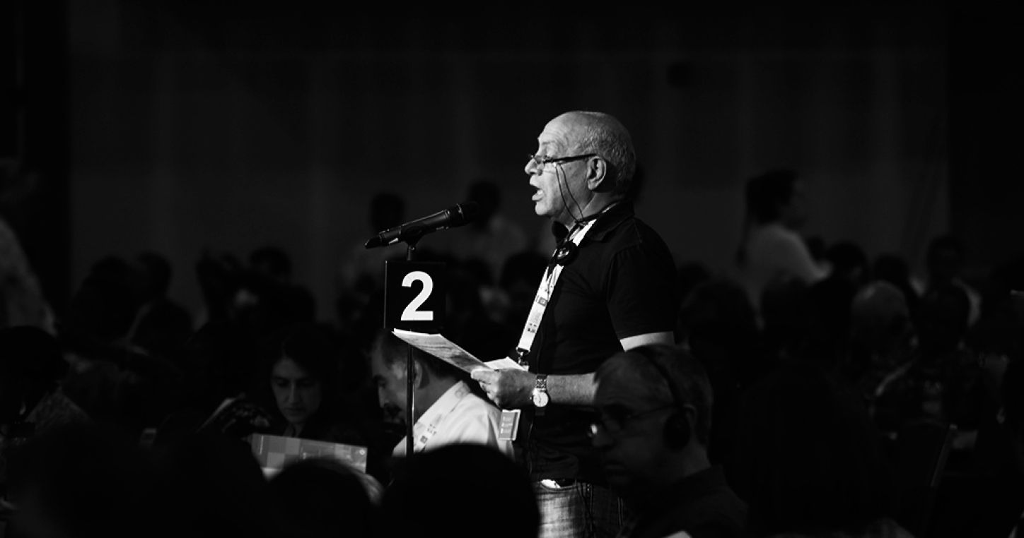 Taher Dhaker speaking during EI's 7th World Congress in Ottawa, Canada, 2015