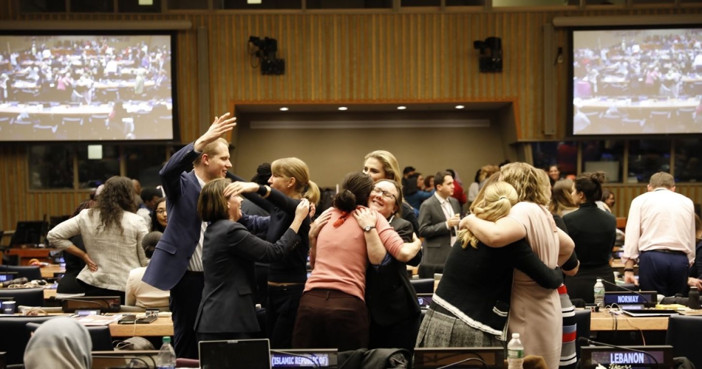 Delegates rejoicing over the adoption of the UNCSW63 Agreed Conclusions.