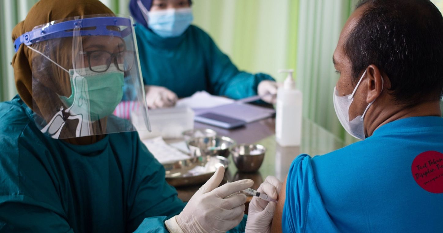 A teacher is vaccinated in Ungaran, Central Java Province, Indonesia on March 25, 2021. Photo: WF Sihardian/Shutterstock/ISOPIX.