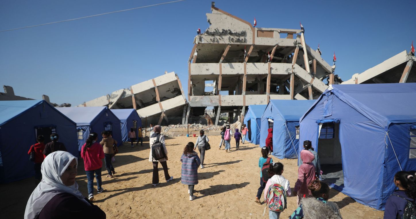 Displaced Palestinian students receive their education inside temporary tents erected near a school destroyed by an Israeli airstrike, in the Nuseirat camp in the Gaza Strip on 31 March 2026 (Photo credit: © Hassan Al-Jedi/APA Images via ZUMA Press Wire).